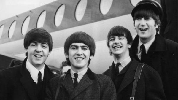 The Beatles arriving at Lo<em></em>ndon Airport in 1964
